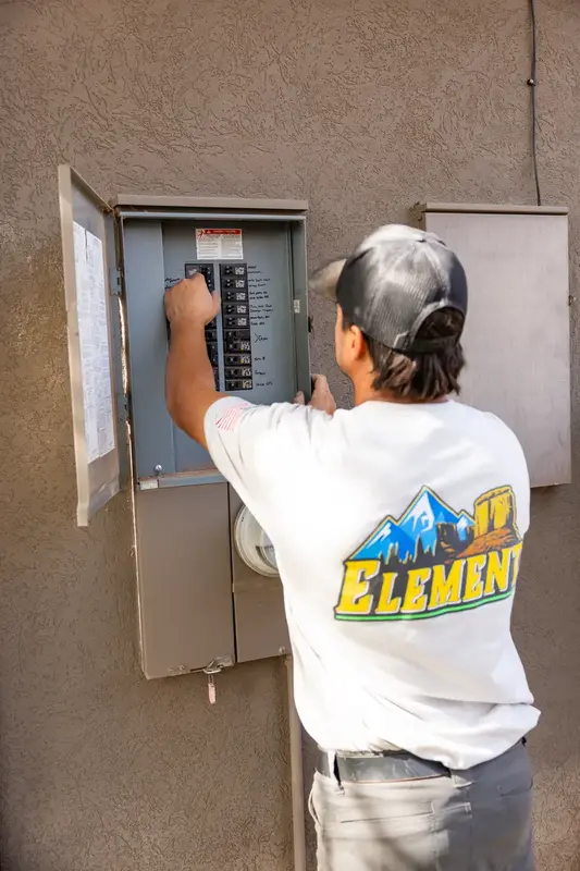 Element electrician checking breakers in St. George, UT