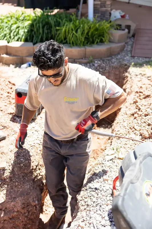 Element plumber feeding an inspection camera into a trench in St. George, UT