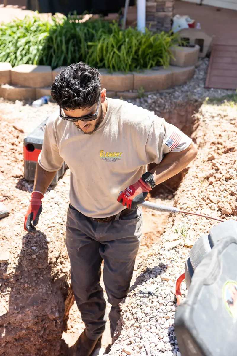 Element plumber feeding an inspection camera into a trench in St. George, UT
