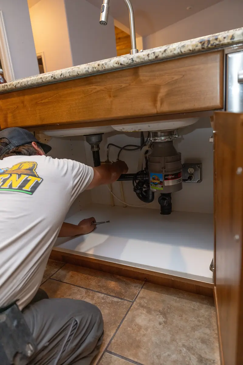 Element plumber repairing kitchen sink plumbing in St. George, UT