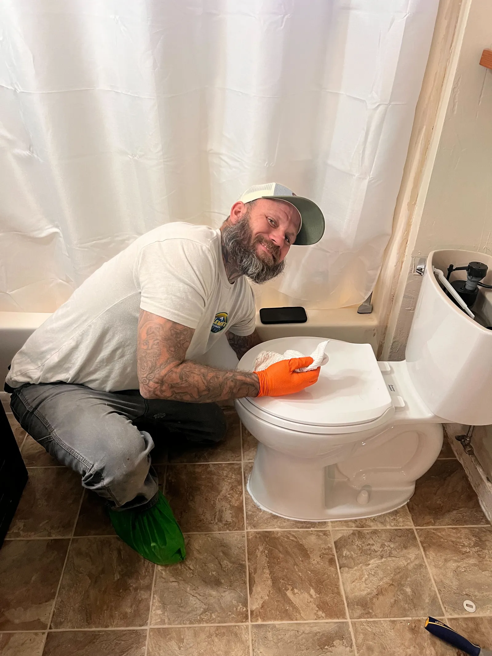 Element plumber sealing the base of a leaking toilet at a customer's home in St. George, Utah