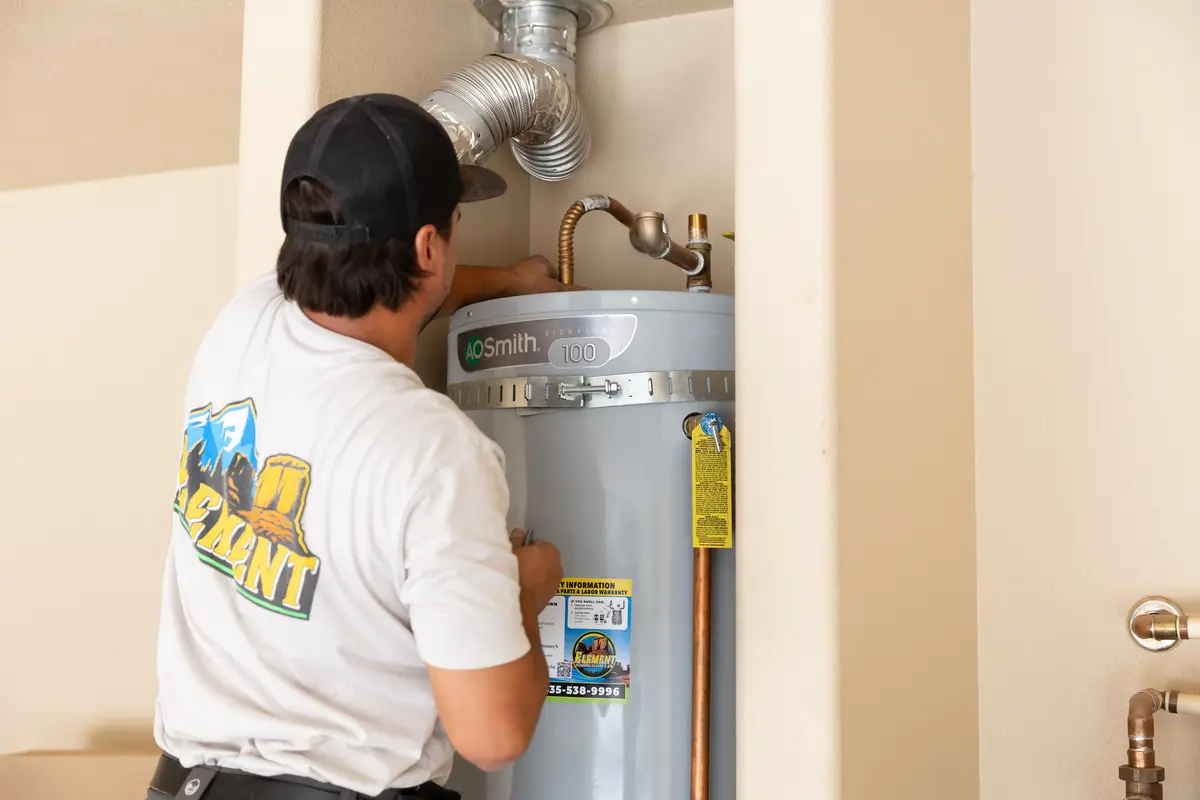 Element technician checking a water heater vent in St. George, UT