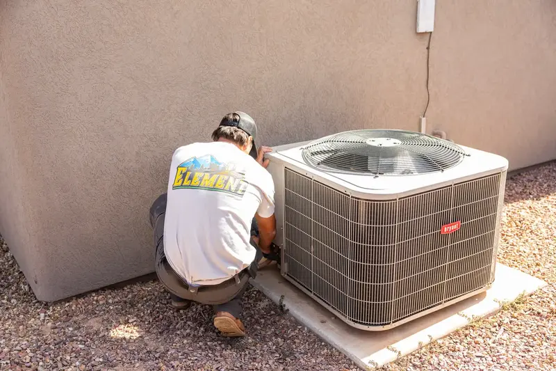 Element technician checking an outdoor AC unit in St. George, UT