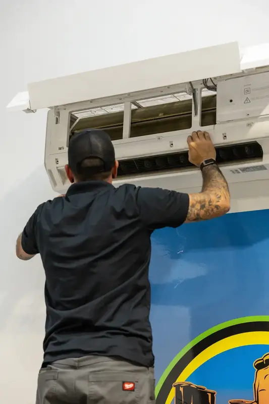 Element technician opening a mini split indoor unit in St. George, UT