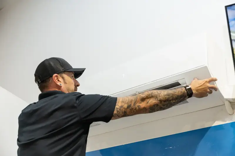Element technician removing a mini split cover in St. George, UT