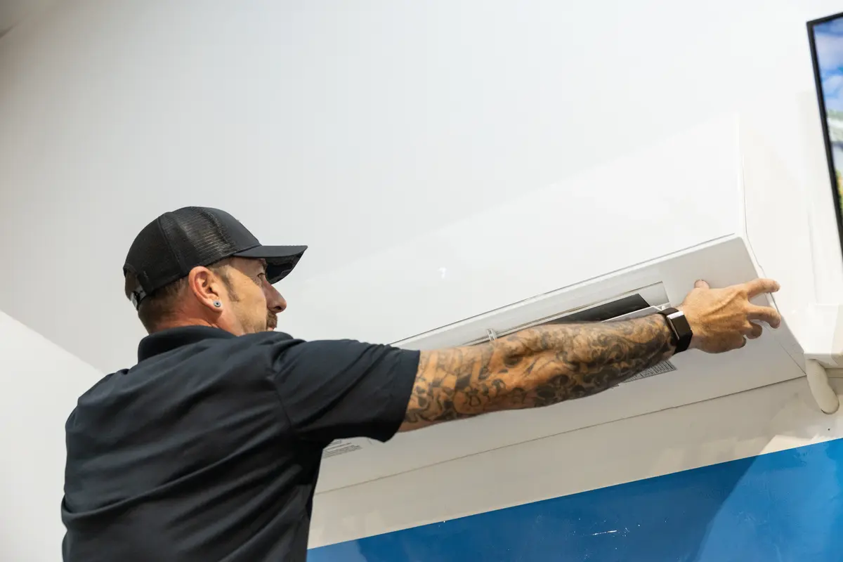 Element technician removing a mini split cover in St. George, UT