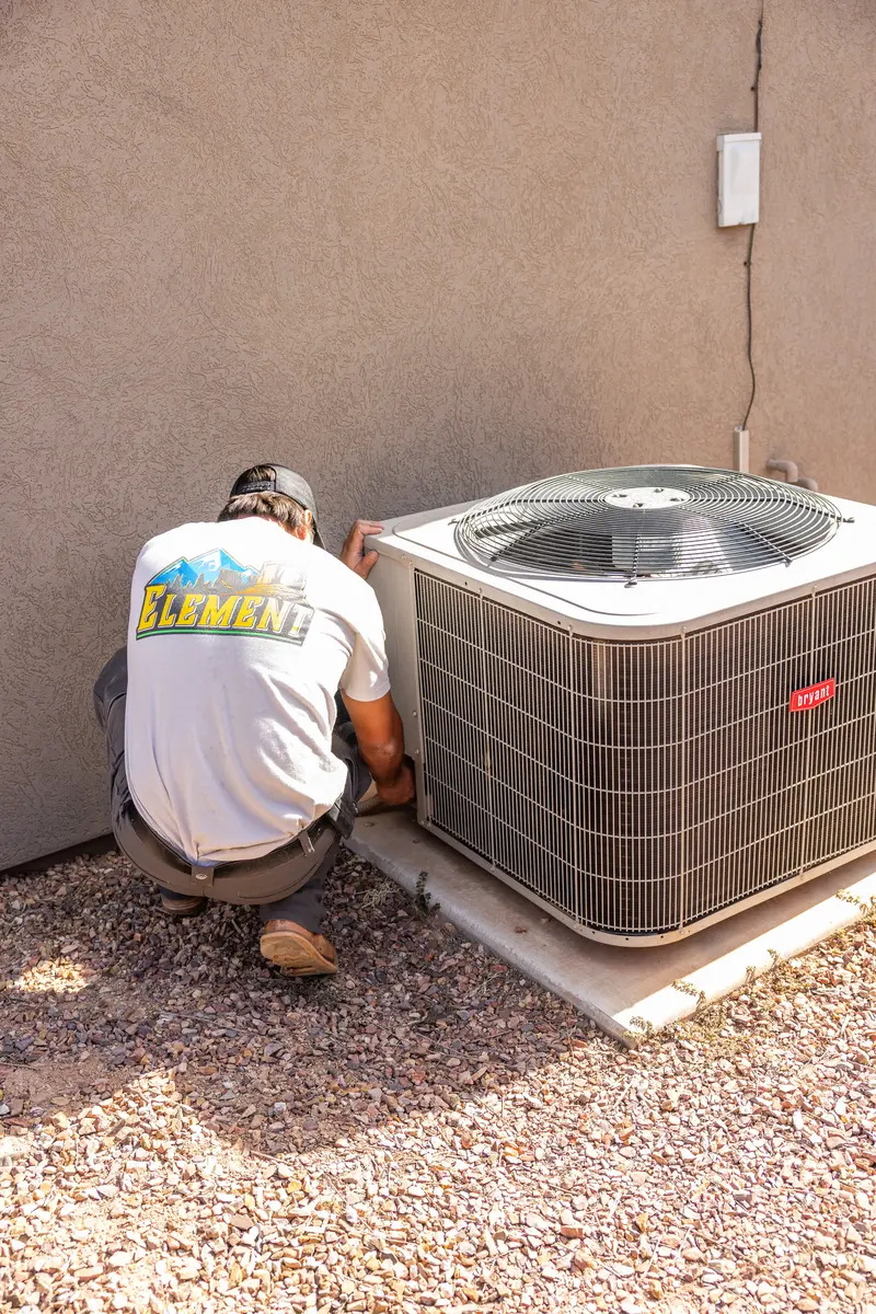 Element technician servicing an AC condenser in St. George, UT